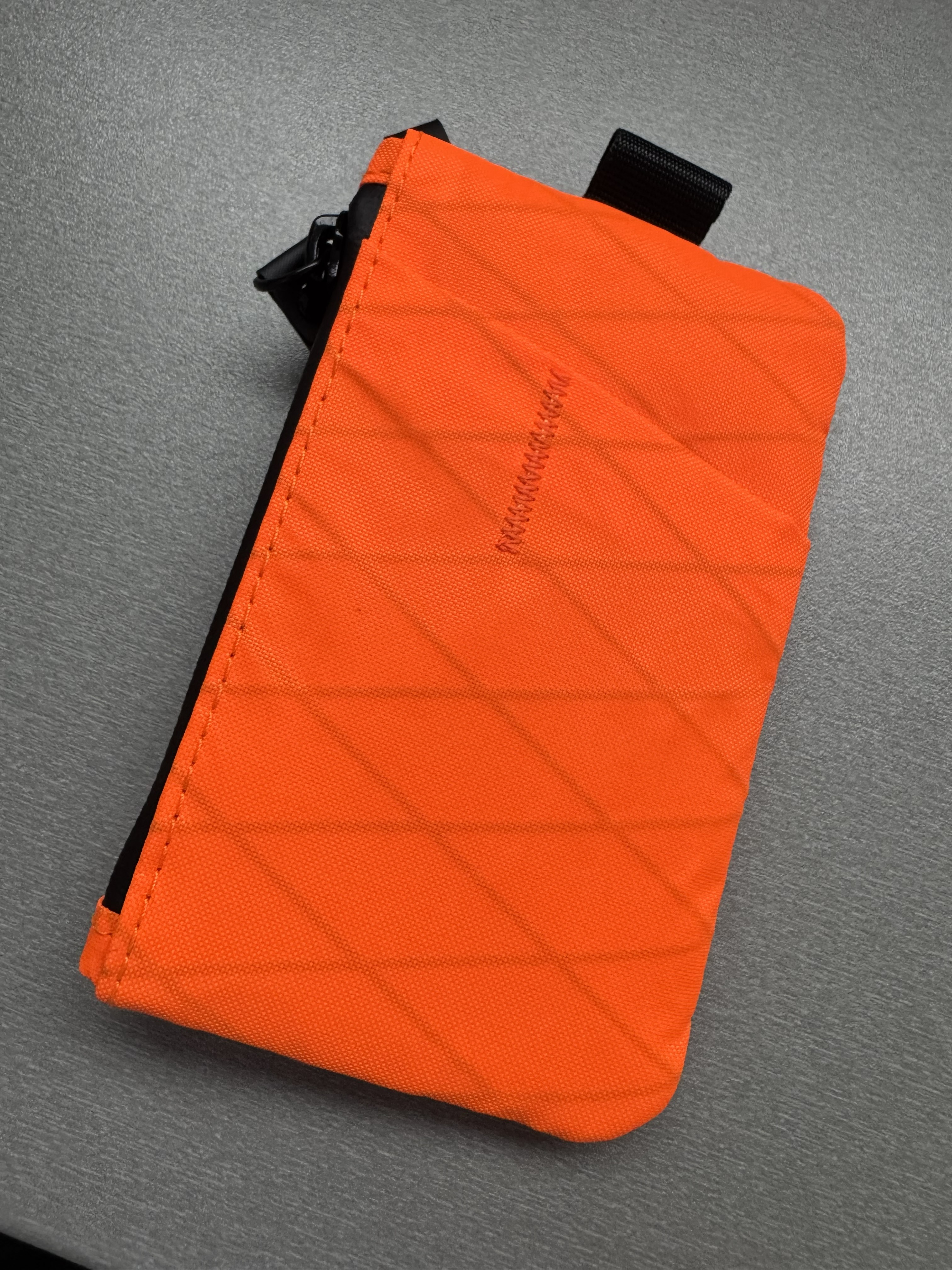 Orange Alpaka Zip Pouch Pro with its compartments open
